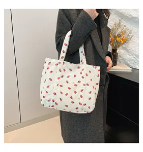 Large white corduroy tote bag featuring a cute strawberry print pattern for women.