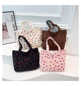 Stylish large capacity corduroy tote bags with cute strawberry patterns in four colors.