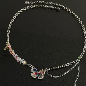 Silver Y2K necklace with colorful stones and sparkling rhinestone butterfly pendant