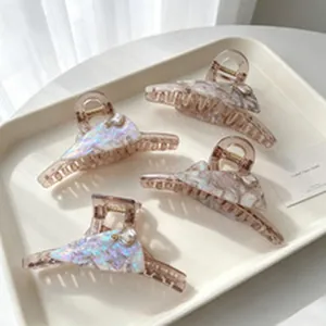 Iridescent blue marbled hair claw clips with elegant rhinestone accents for women