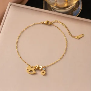 Elegant gold titanium steel anklet featuring a rocking horse charm and K18 logo tag