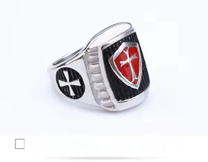 Detailed macro view of retro crusader stainless steel ring with red enamel cross shield