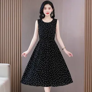 Elegant sleeveless black polka dot midi dress with cinched waist on Asian model
