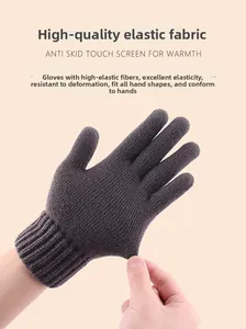 Close-up showing high elasticity of dark grey knitted thermal touch screen gloves
