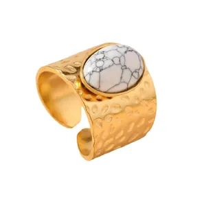 Vintage gold stainless steel open ring featuring a large oval white veined natural stone