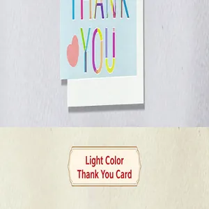 Detailed view of light blue thank you card with colorful typography and heart.