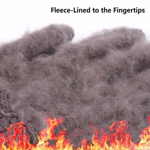 Close-up of thick grey fleece lining in winter gloves showing fingertip warmth.