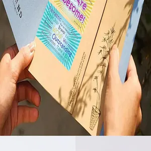 Close-up of hands holding various colorful English thank you and appreciation cards.