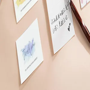 Macro shot of assorted premium cardstock greeting cards with watercolor accents and pen