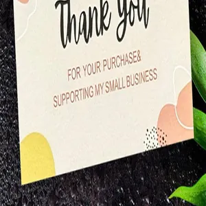 Close-up of text detail on a premium small business thank you card with nature accents