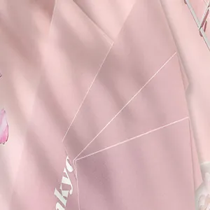 Close-up of premium pink greeting card with elegant white geometric lines and smooth texture