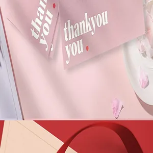 Detailed close-up of premium pink 'thank you' cards with elegant white text print