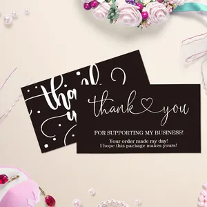 Detail of elegant black thank you cards with white script and heart icon