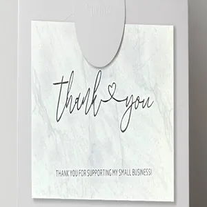 Marble texture thank you card detail showing elegant script and business message