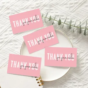 Set of pink Thank You for Your Order cards displayed on a white ceramic plate backdrop