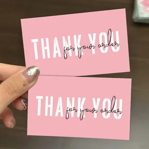 Close-up detail view of high-quality pink thank you cards with white and black lettering