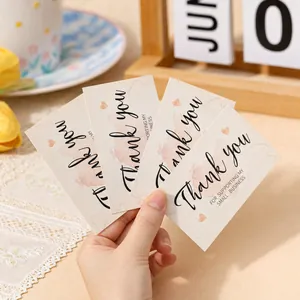 Close-up of four artistic thank you cards for small businesses with watercolor hearts