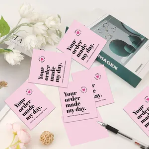Detailed macro shot of pink thank you cards featuring 'Your order made my day' text