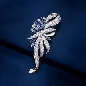 Detailed macro shot of silver brooch with blue crystals and sparkling white stones