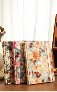 Tres cuadernos A5 vintage de pana floral con cubiertas de tela texturizada para diario
