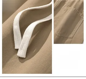 Detailed macro shot of men's khaki cotton pants featuring drawstring and pocket textures