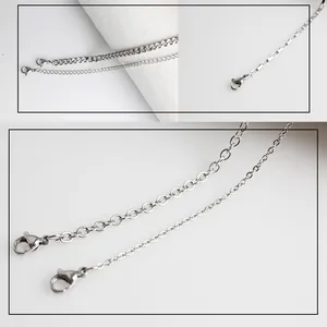 Detailed close-up of various stainless steel chain styles with secure lobster clasps.