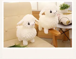 Detail view of cute white plush sheep toys featuring soft curly wool and sweet expressions