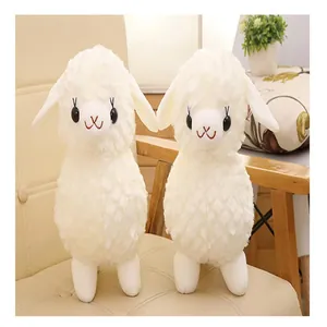 Two soft white sheep plush toys standing on a chair, ideal birthday gift for girls