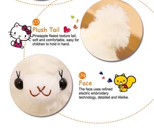 Close-up detail of white plush lamb toy showing soft tail and embroidered face