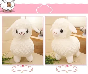 Detail views showing the front and side of a soft white plush sheep stuffed toy