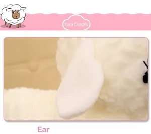 Macro detail of the soft white faux fur ear on a cute simulated little sheep plush toy
