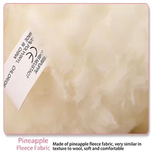 Macro detail of soft pineapple velvet fabric texture on sheep plush toy