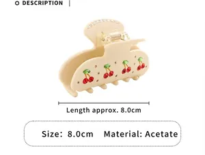 Detailed view of an acetate cherry hair claw clip showing 8.0cm size and material info