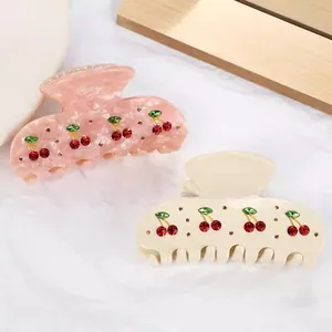 Elegant French acetate hair claw clips featuring sparkling rhinestone cherry patterns