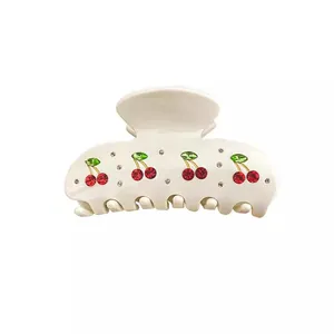 Elegant cream acetate hair claw clip with sparkling rhinestone cherry design for women
