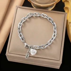 Elegant silver stainless steel chain bracelet featuring a heart-shaped pearl charm