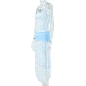 Side view of light blue polka dot camisole crop top and matching midi skirt set