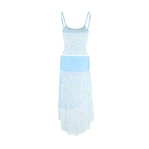 Detailed view of light blue polka dot camisole crop top and matching midi skirt set