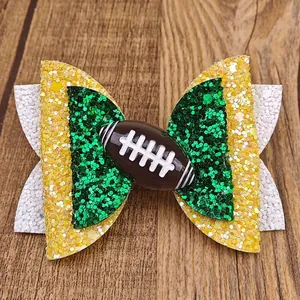 Barrette à cheveux pailletée thème football américain avec sequins jaunes et verts