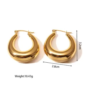 Detail of golden titanium steel hollow hoop earrings with size and weight markers