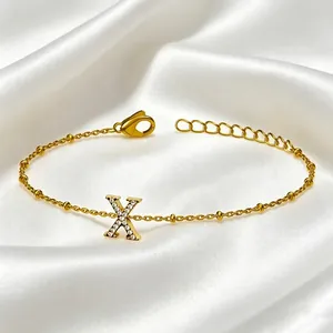 Elegant gold titanium steel bracelet with crystal-encrusted letter X charm
