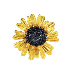 Detailed macro view of a vibrant yellow enamel daisy brooch with realistic petals