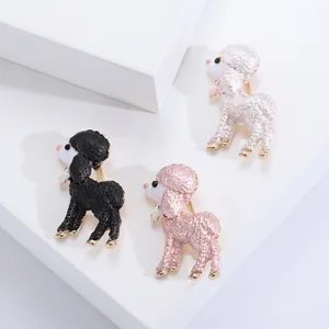 Detail view of cute colorful poodle enamel brooches with gold trim and rhinestones.