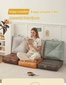 Lifestyle view of comfortable Japanese floor cushions in various colors in a living room.