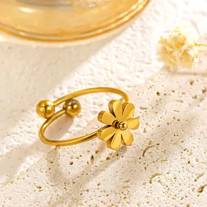 Macro detail view of an elegant golden daisy flower ring crafted in titanium steel