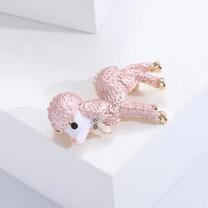 Detailed macro view of a cute pink enamel sheep brooch with elegant gold-plated accents.