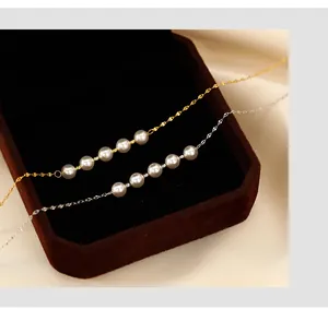 A detailed close-up shot of elegant smile pearl necklaces in gold and silver finishes