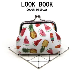 Detailed view of a cute fruit print coin purse with a vintage kiss-lock closure.