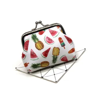 Detailed view of cute fruit print coin purse with vintage metal kiss-lock closure