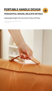 Close-up detail of the durable portable handle on an orange Japanese style floor futon cushion
